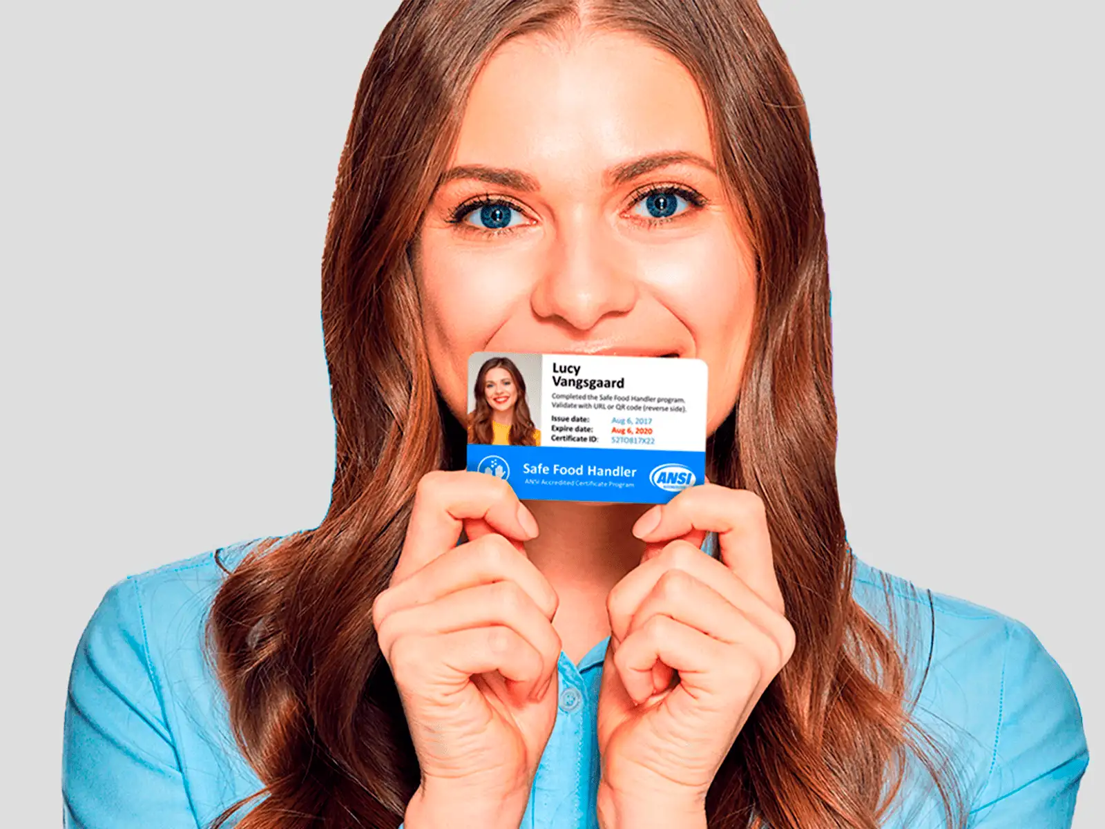 A woman smiling holding card